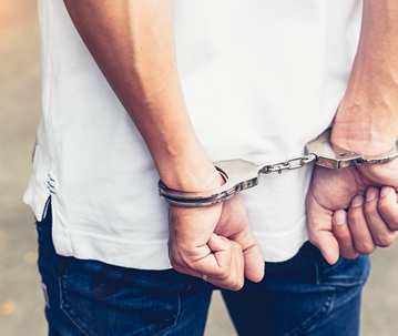 close up on male in handcuffs