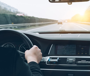 person driving in car